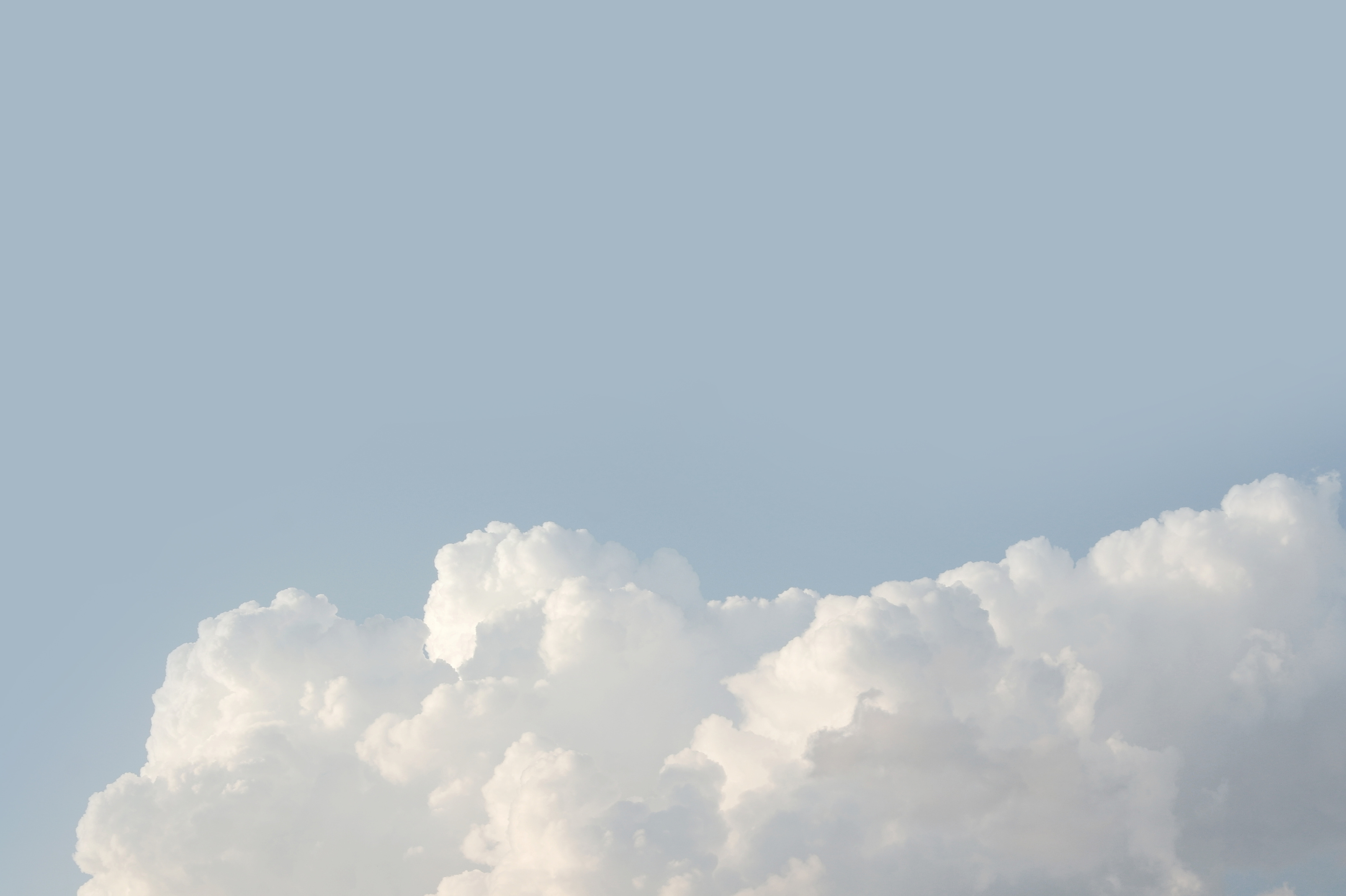 White Clouds on Blue Background 